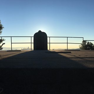 A Lyle held up in front of Hawk Hill
