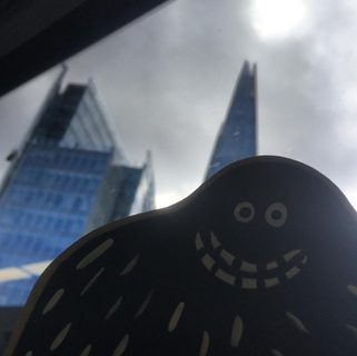 A Lyle held up in front of The Shard