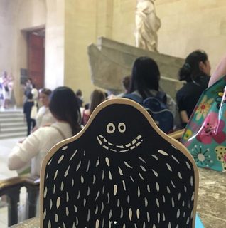 A Lyle held up in front of Paris