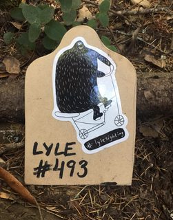 A Lyle held up in front of Camp Tamarancho