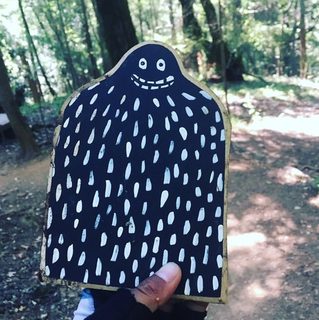 A Lyle held up in front of Tamarancho Mountain Biking Loop, CA