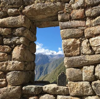 A Lyle held up in front of Machu Picchu, PERU