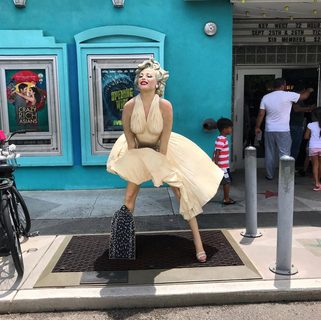 A Lyle held up in front of Tropic Cinema
