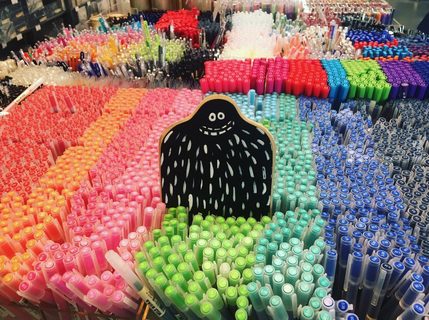 A Lyle held up in front of MUJI
