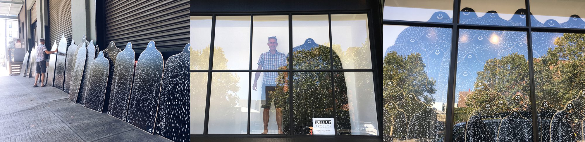 Three photographs: a long row of Lyle boards propped along a street wall, and Lyles filling the tall windows of a gallery storefront.