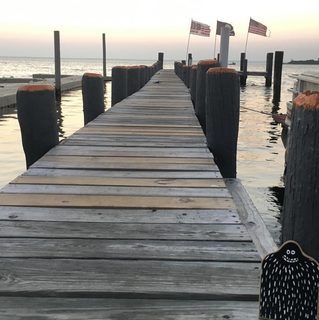 A Lyle held up in front of Long Beach Island