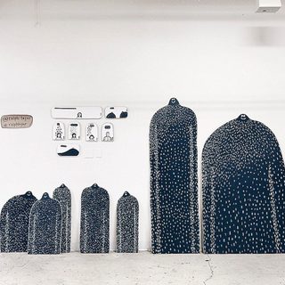 A Lyle held up in front of Unique LA