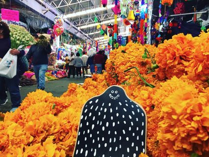 A Lyle held up in front of Mercado Jamaica