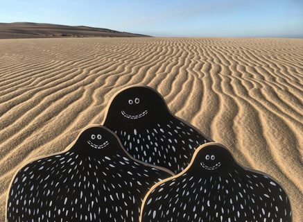 A Lyle held up in front of Rancho Guadalupe Dunes