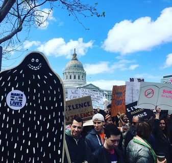 A Lyle held up in front of March for Our Lives