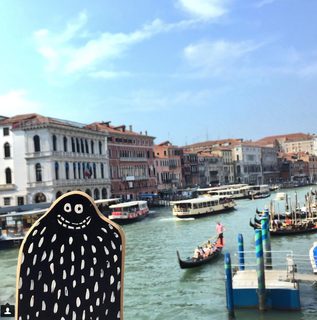 A Lyle held up in front of Venice